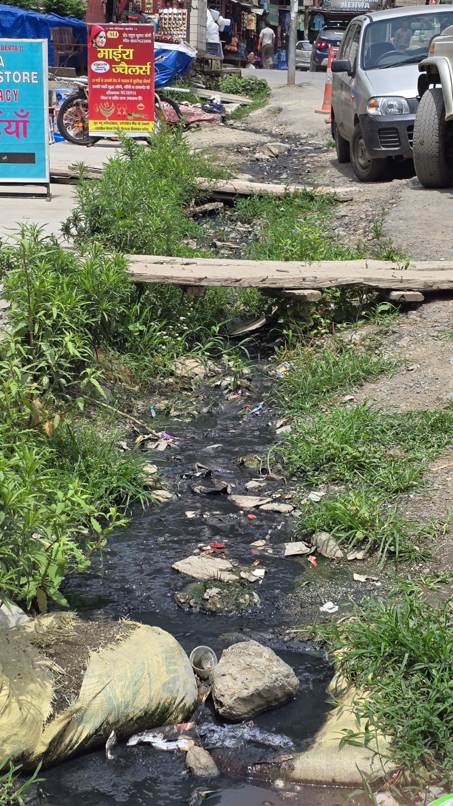 Broken drains cause trouble in Nerva market