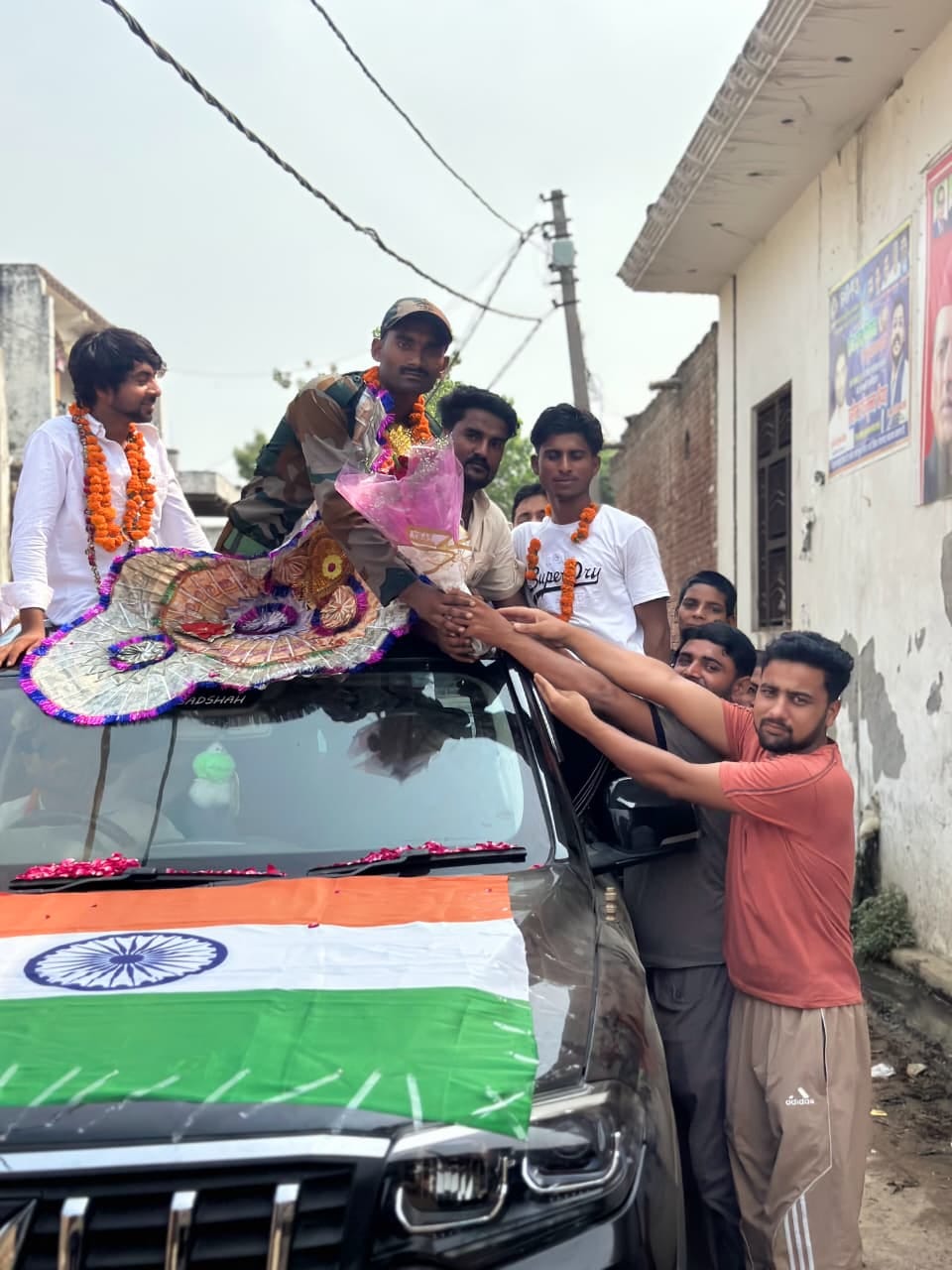 Three youths welcomed upon returning after completing training.