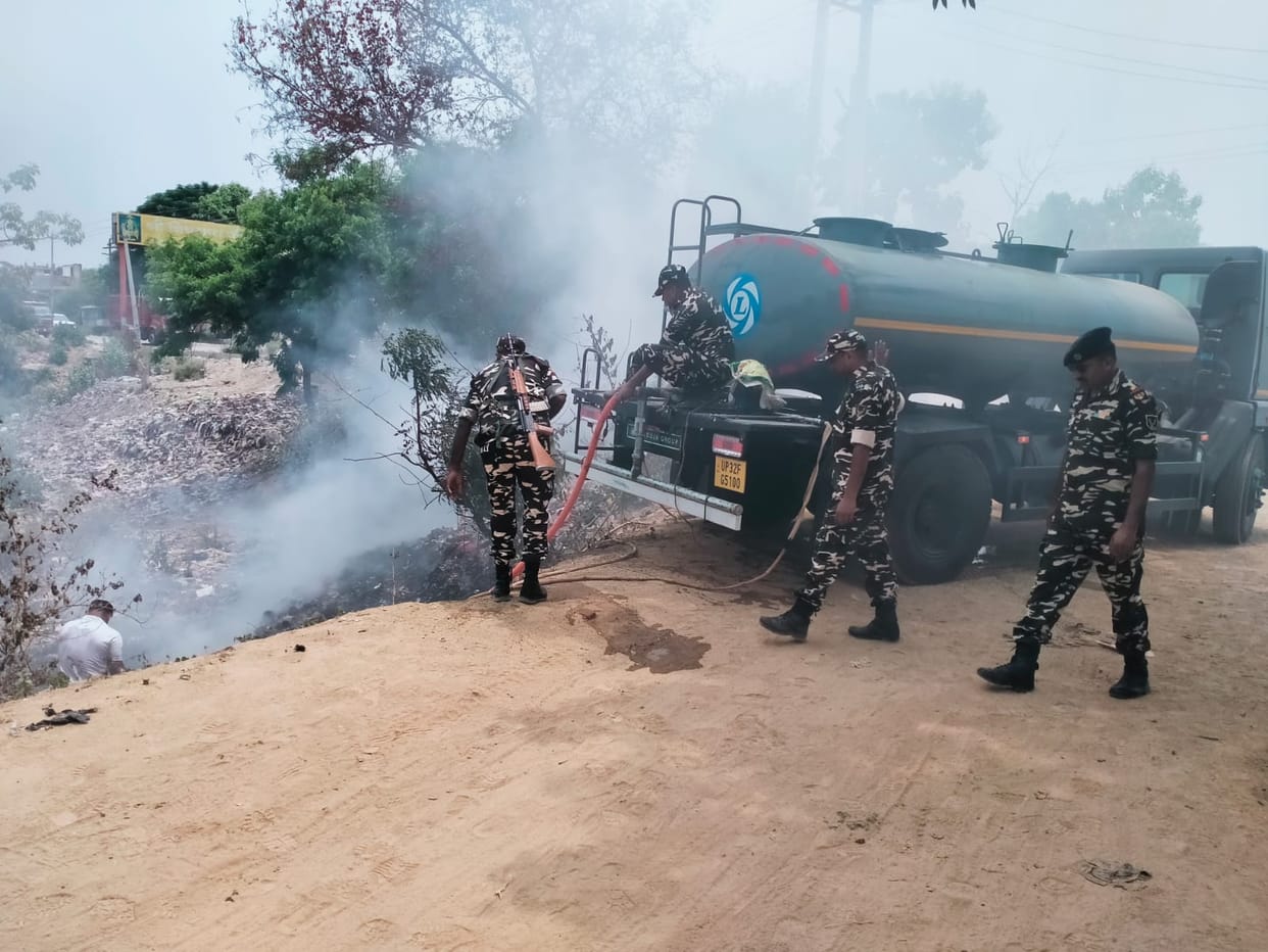 Small trees scorched by a fire in domestic waste, SSB jawans doused the flames.