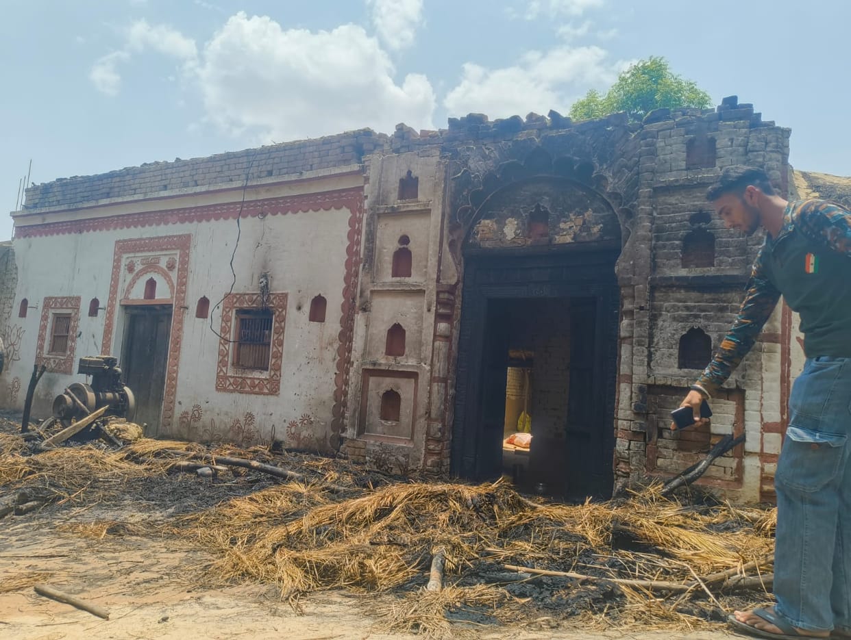Three thatched sheds gutted; mutual accusations of arson.