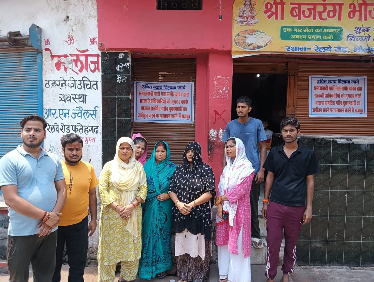 Political standoff before anti-encroachment drive; posters listing allegations pasted on shops.