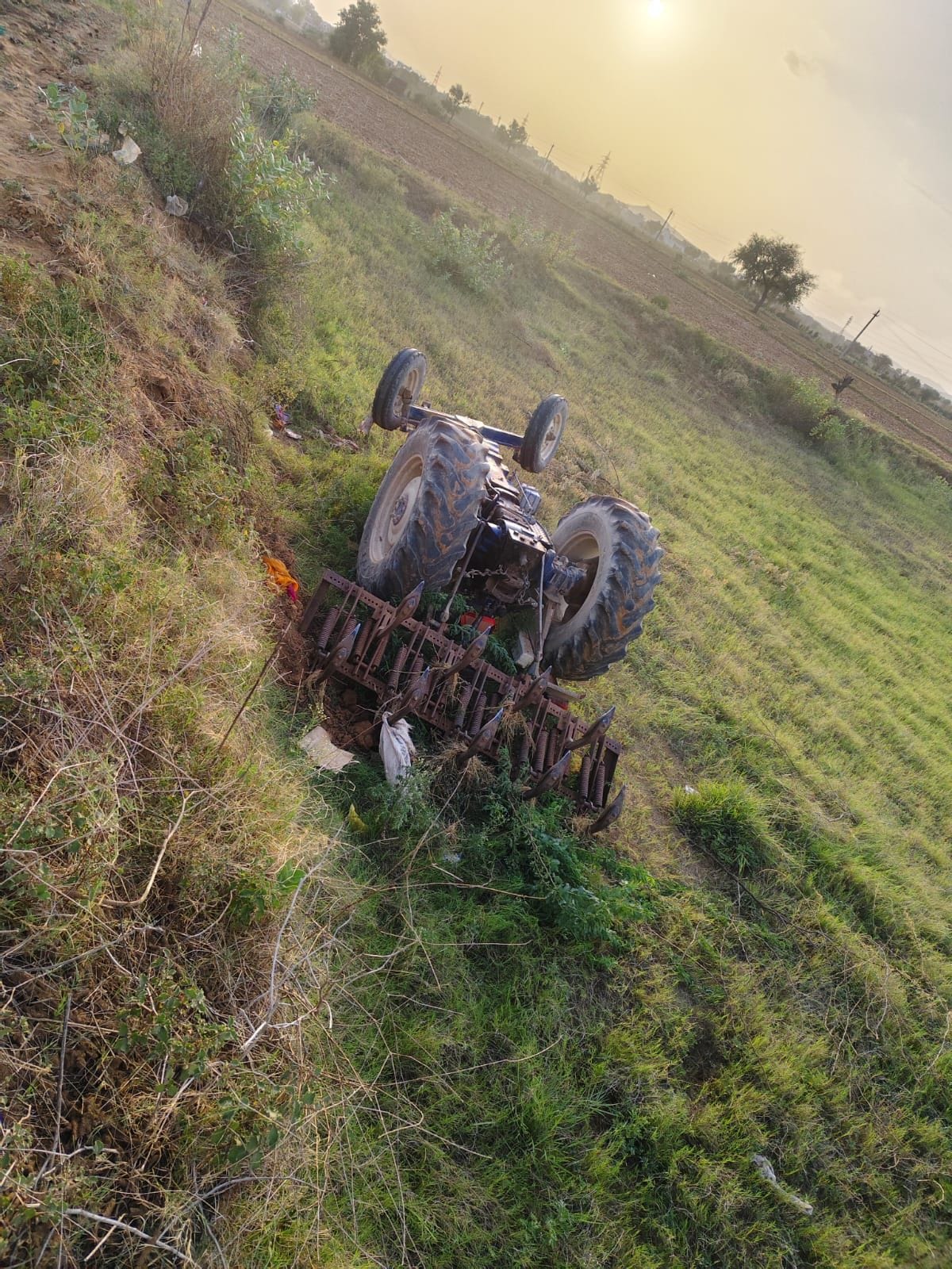 Grandfather and grandson die after tractor overturns while ploughing the field.