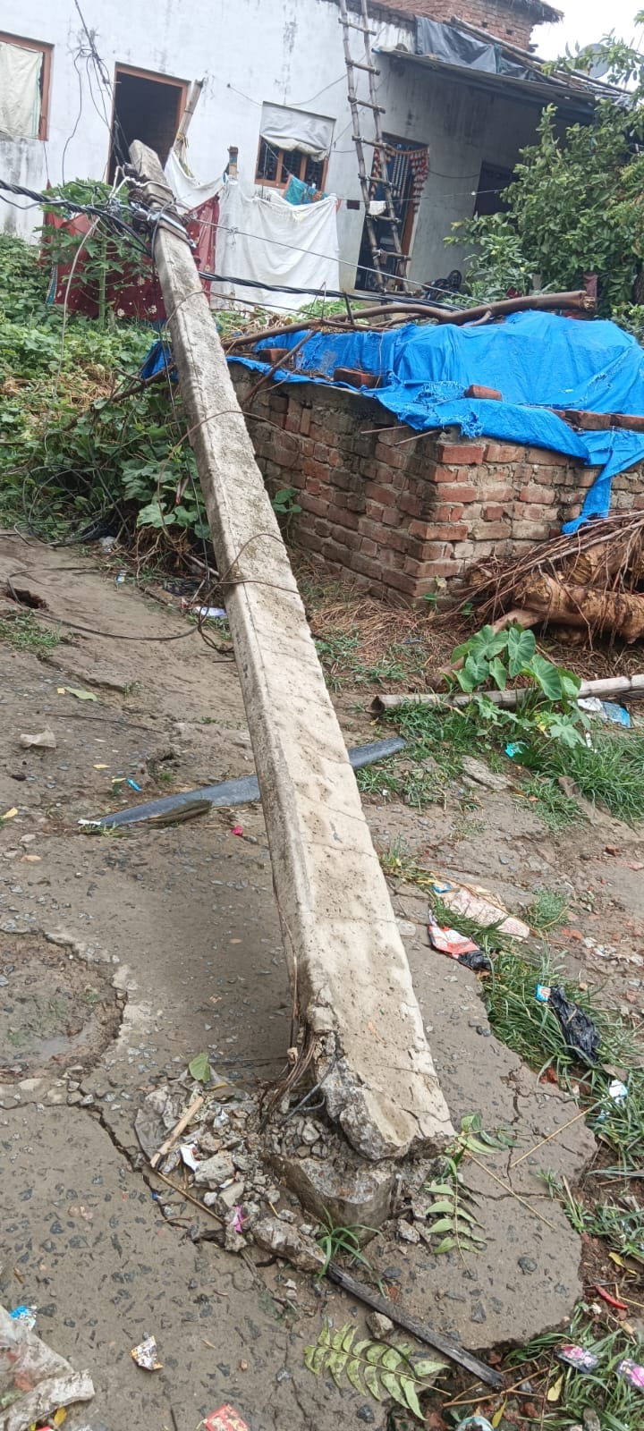 12 poles toppled by storm and rain; power outage.
