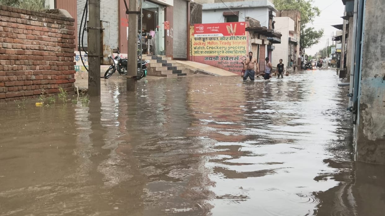 Weather turns pleasant after 15 mm of rainfall.