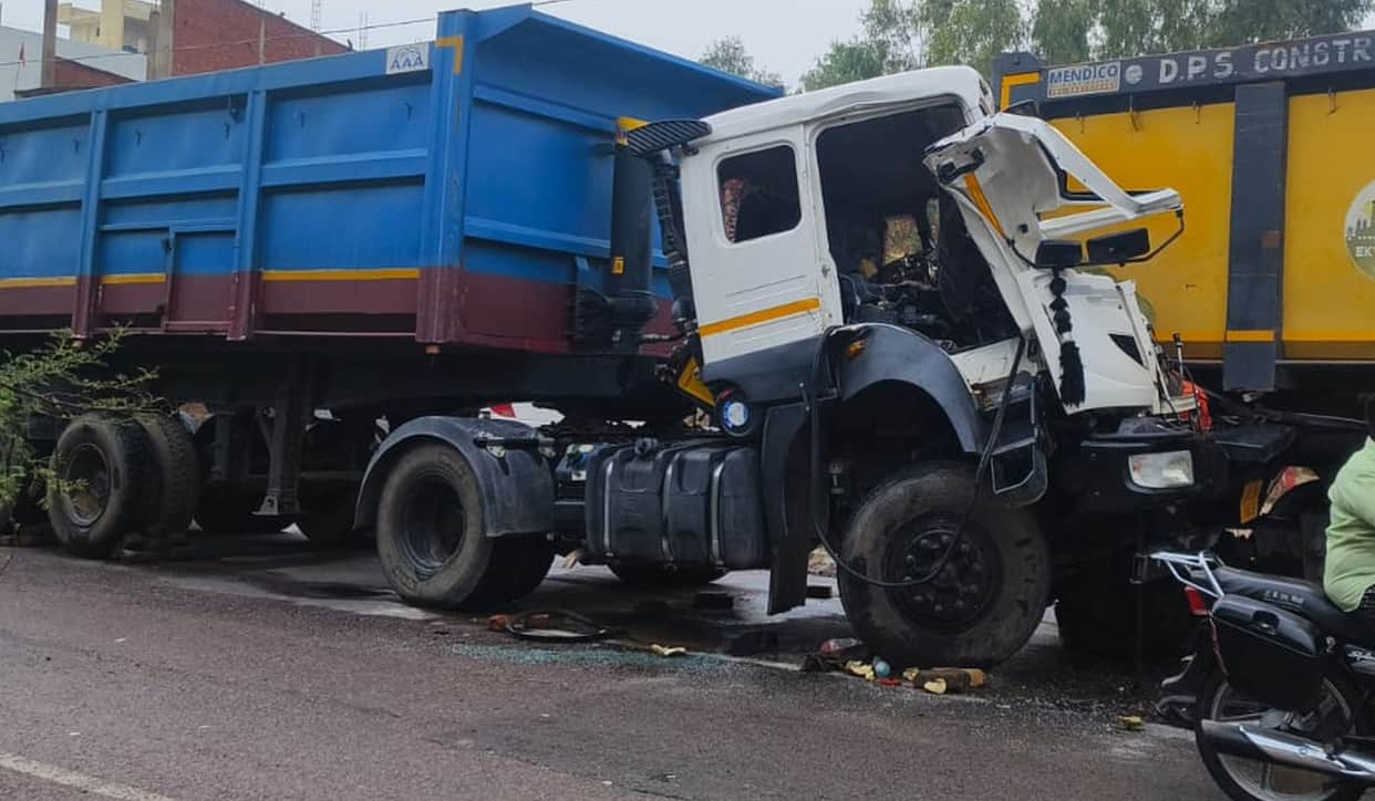 Highway traffic jam following collision between two trailers; drivers critically injured