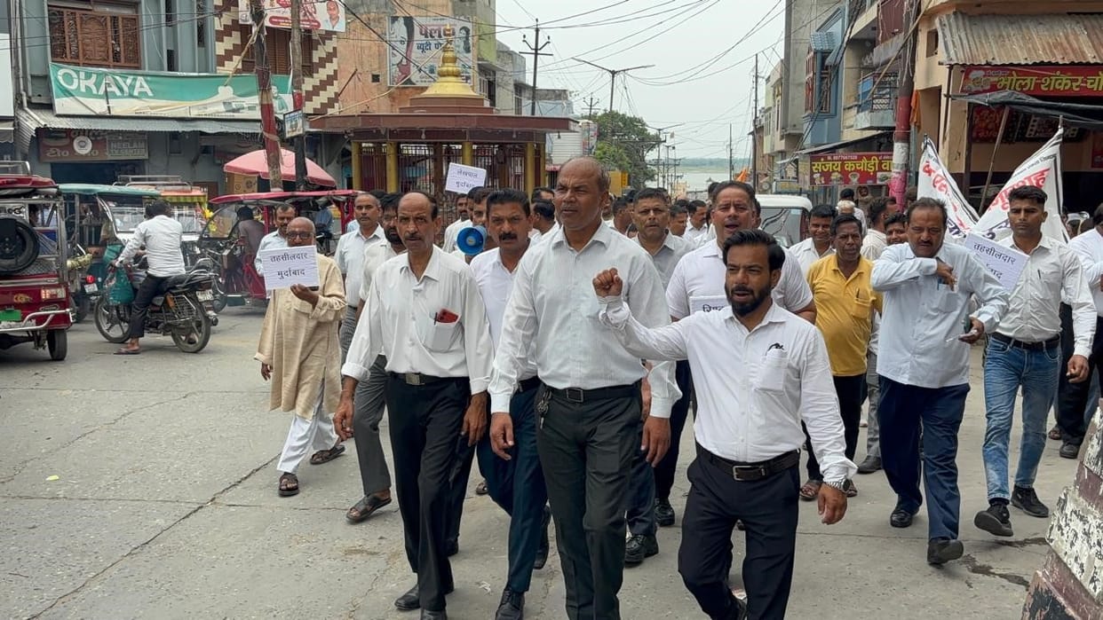 Lawyers took to the streets carrying placards reading "Down with the SDM."
