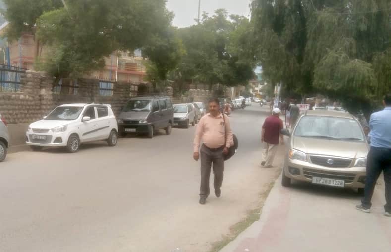 Vehicles on the footpath... pedestrians on the road.