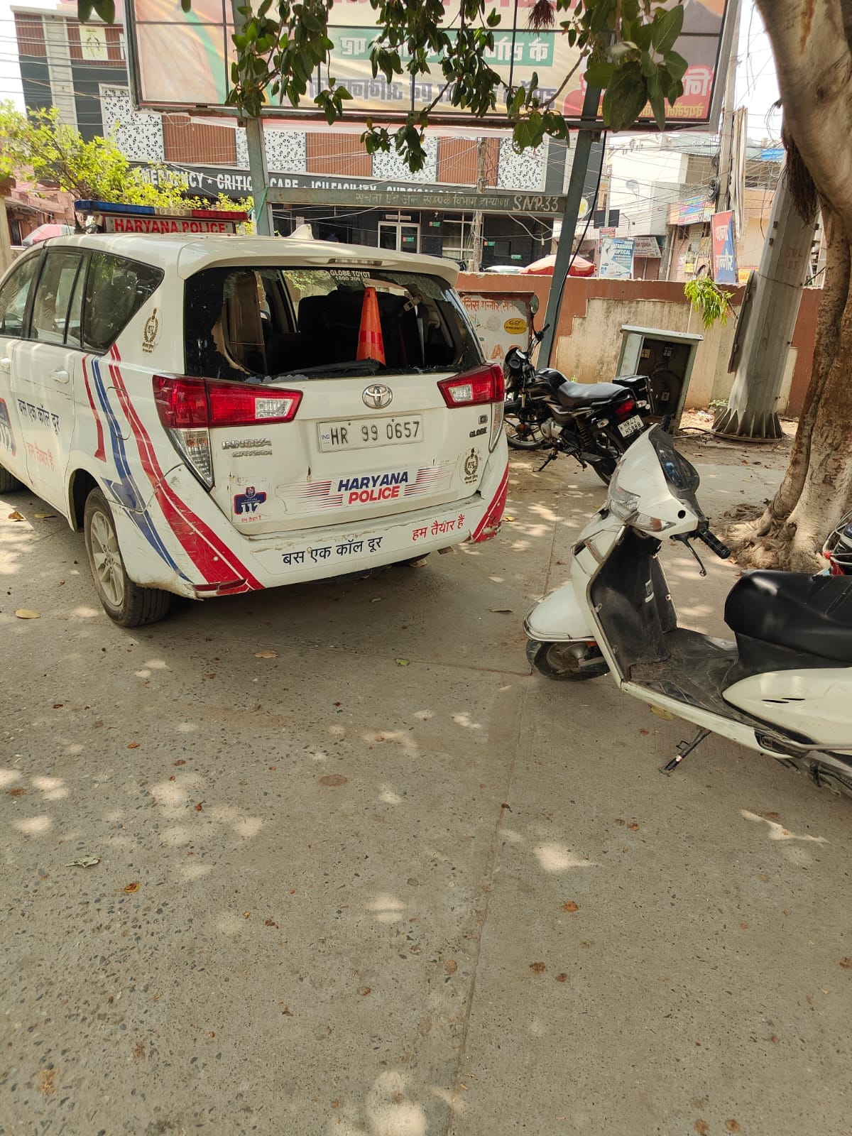 Son attacks police personnel who arrived following his mother's complaint; pelts stones at official vehicle.