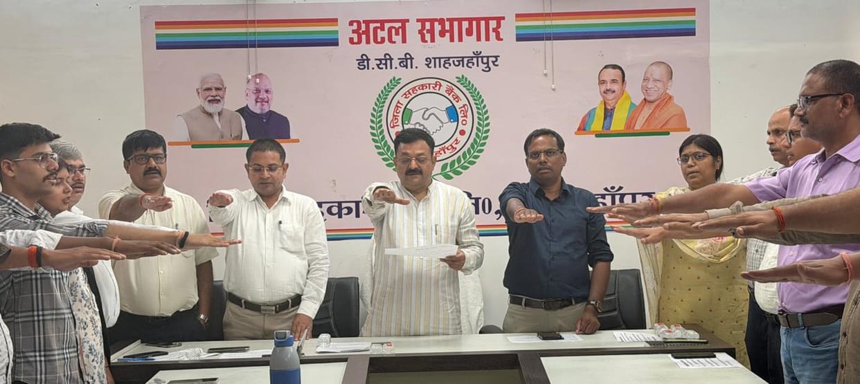 Cooperative officials and employees administered an oath to uphold the principles.