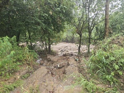 Small bridge becomes a problem in Nanavi; rainwater diverted towards it.
