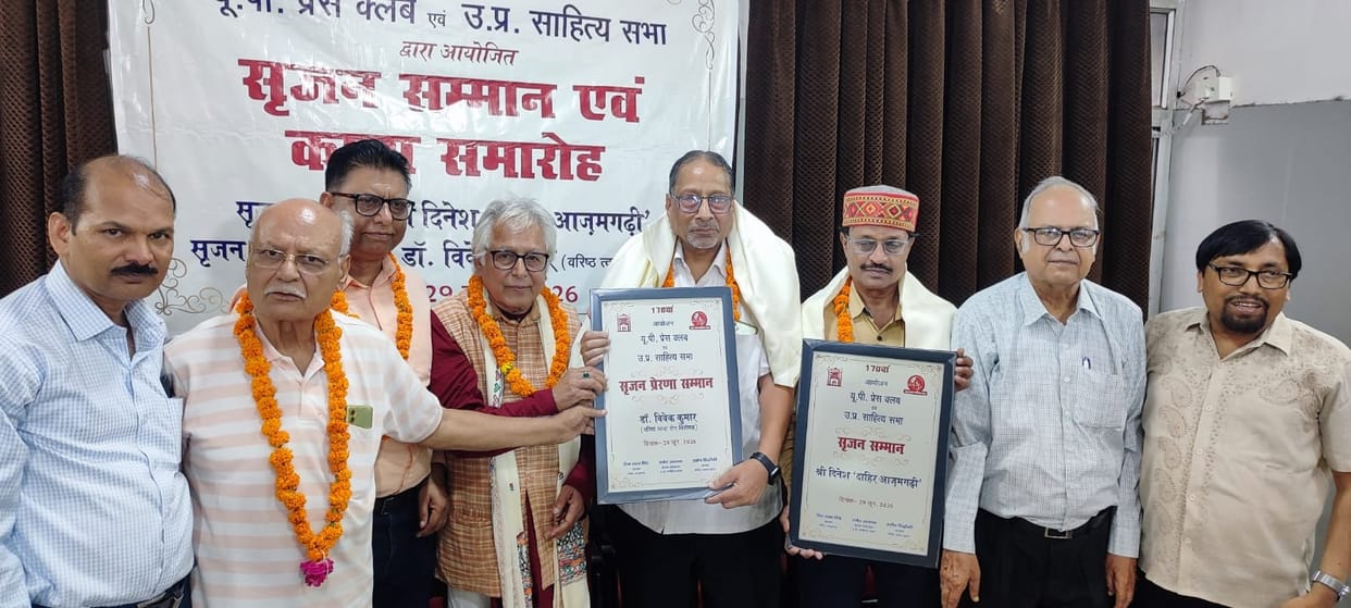 Dr. Vivek and Dahir honored for literature and social service.