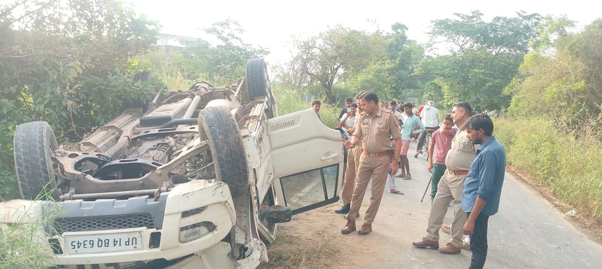 Car overturns into ditch; seven injured, including bride and groom.