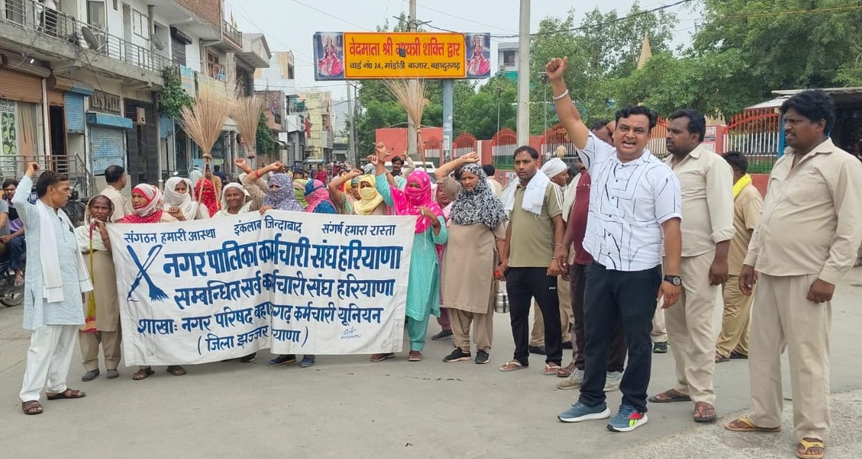 Sanitation workers stage 'broom protest'; warn of agitation.