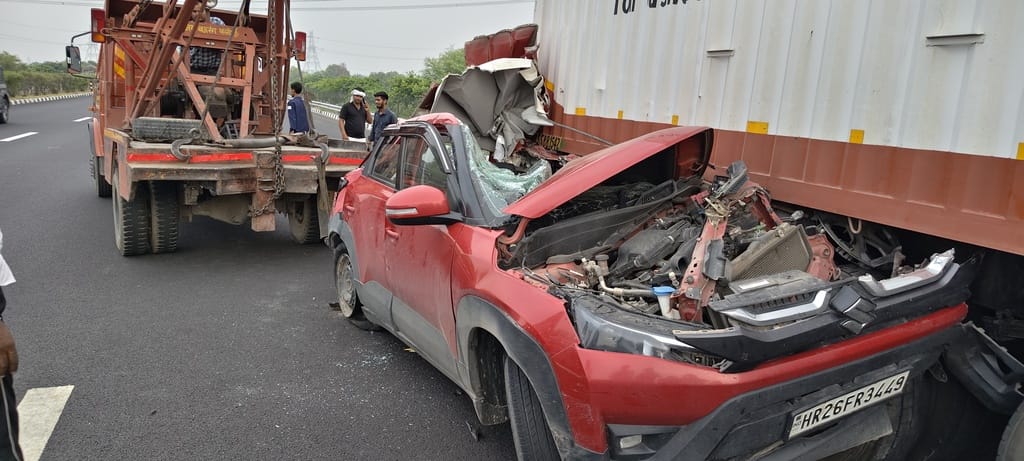Car crashes into truck on expressway after tyre burst; four injured.
