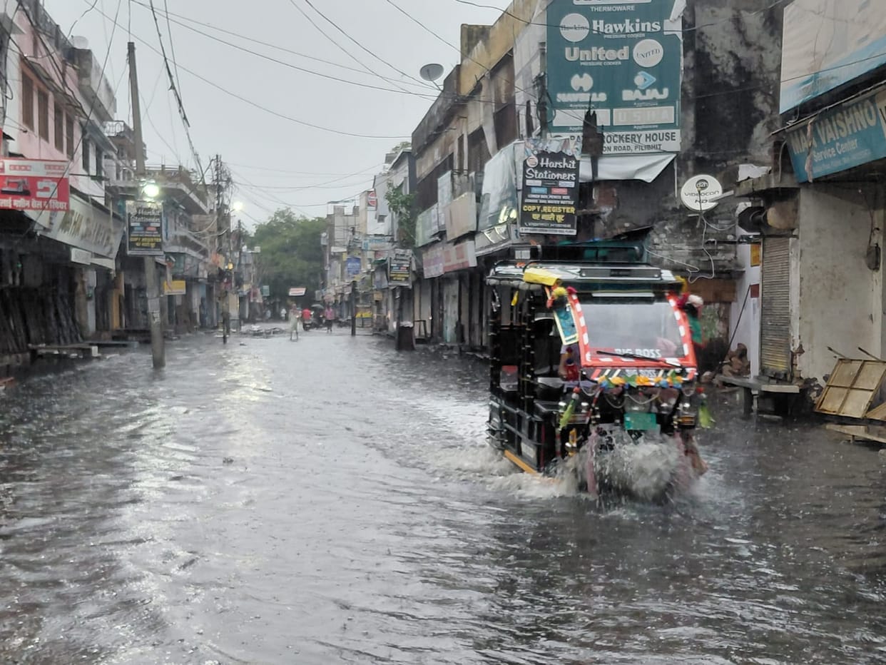 Roads flooded due to rain; drain cleaning claims exposed as a sham.