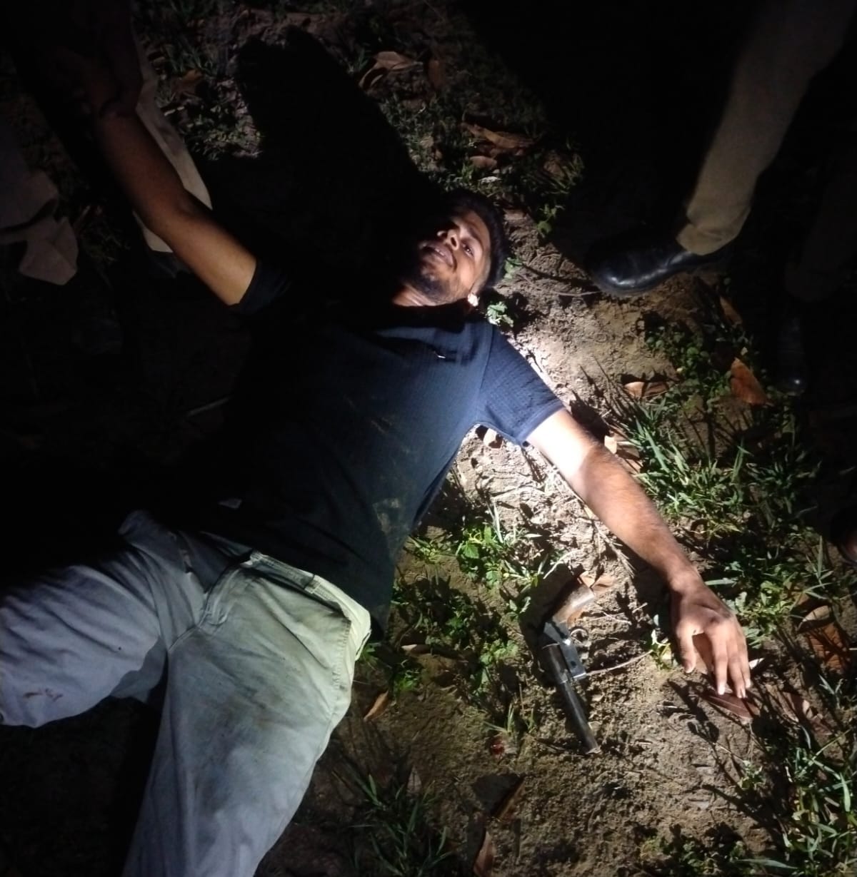 Arms smuggler shot in the leg during an encounter; accomplice also arrested.