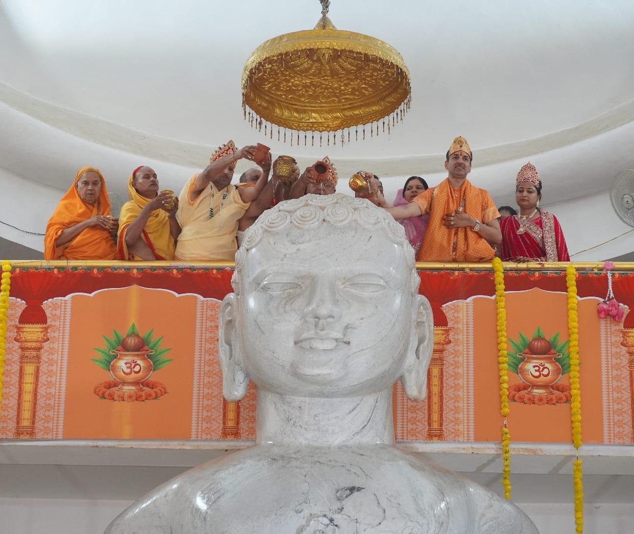 Abhishek and worship of Lord Rishabhdev performed at the Jain temple