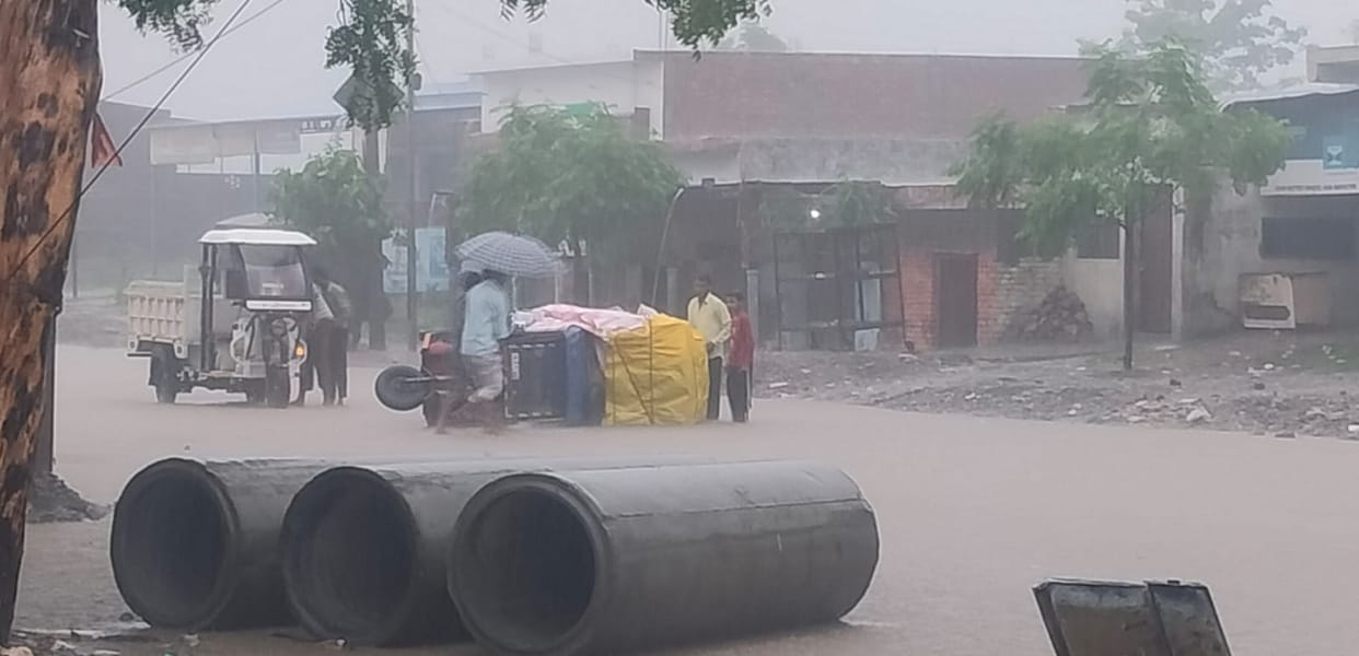 Rainwater hid a pothole, causing the auto to overturn