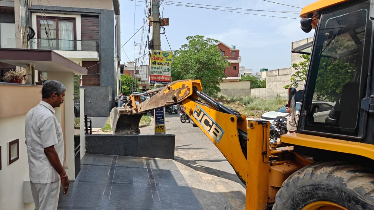 Encroachment: Layers of illegal construction were torn down in Sector-3 as the bulldozer rolled in