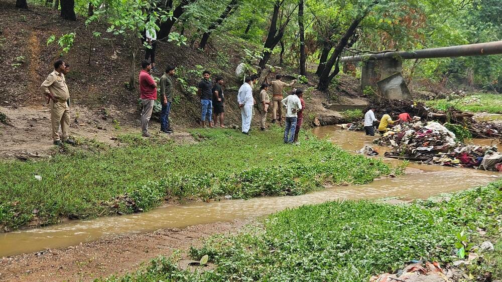 Mother and daughter swept away in a monsoon drain; bodies recovered after hours of searching.