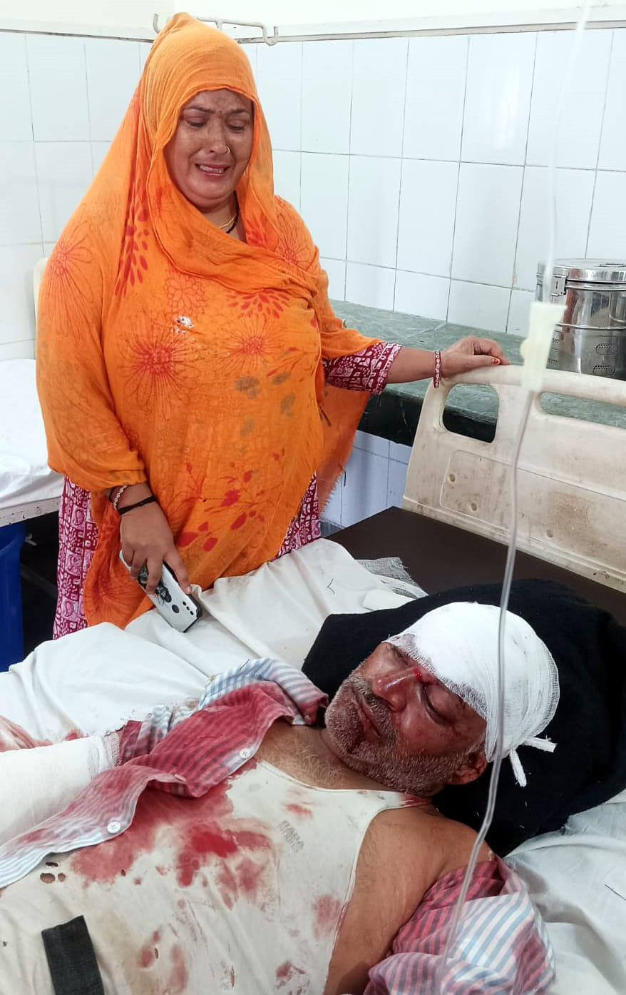 Injured person writhing on the road; teacher rushed him to the hospital in her car.