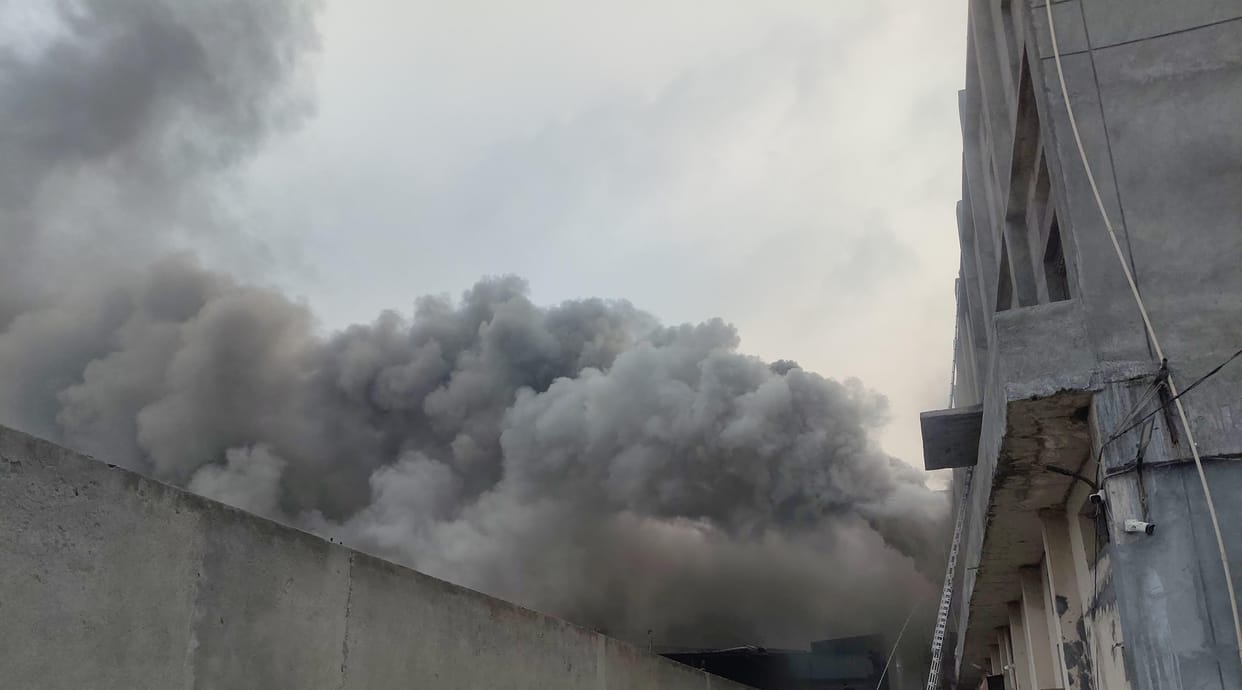 Massive fire breaks out at a cloth warehouse; 12 fire tenders from five fire stations are engaged in efforts to extinguish the blaze.