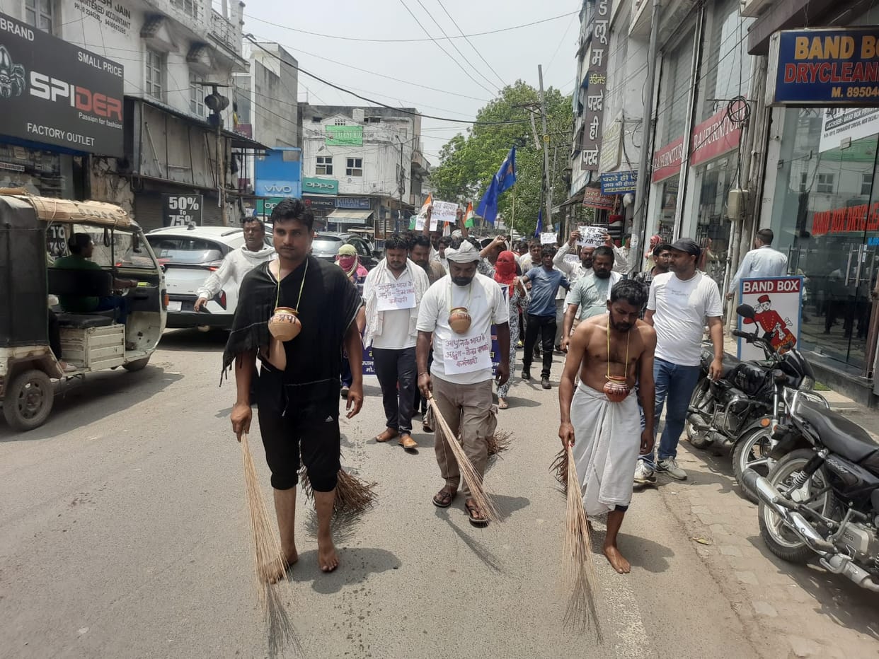 A procession was taken out with the 'pot' of the contract labor system tied around the neck.