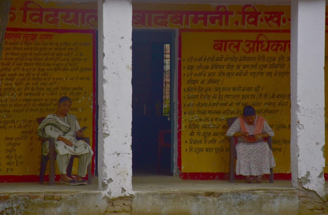 The children kept playing, while the teachers kept using their mobile phones
