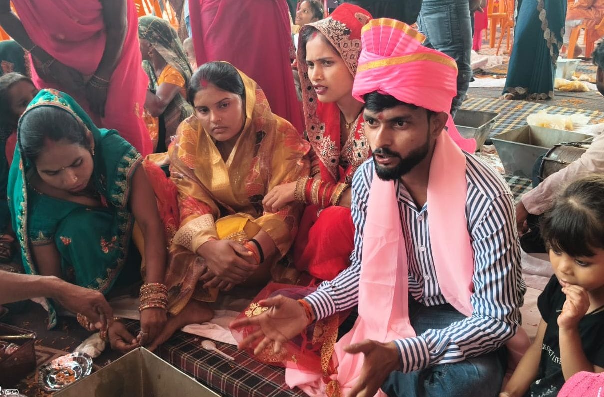 267 couples tie the knot; rain disrupts arrangements.