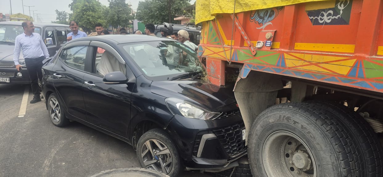 Teacher's car rams into stationary truck; life saved as airbag deploys.