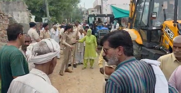 Construction of the stalled drain in Chamariya has resumed; police removed the villagers.