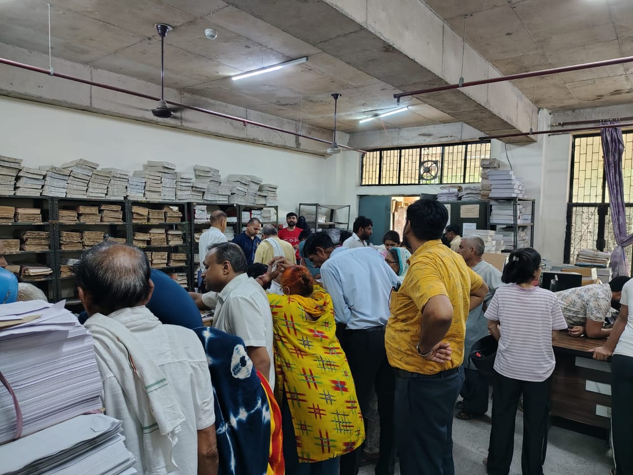 People gathering information regarding SIR after arriving at the District Secretariat.