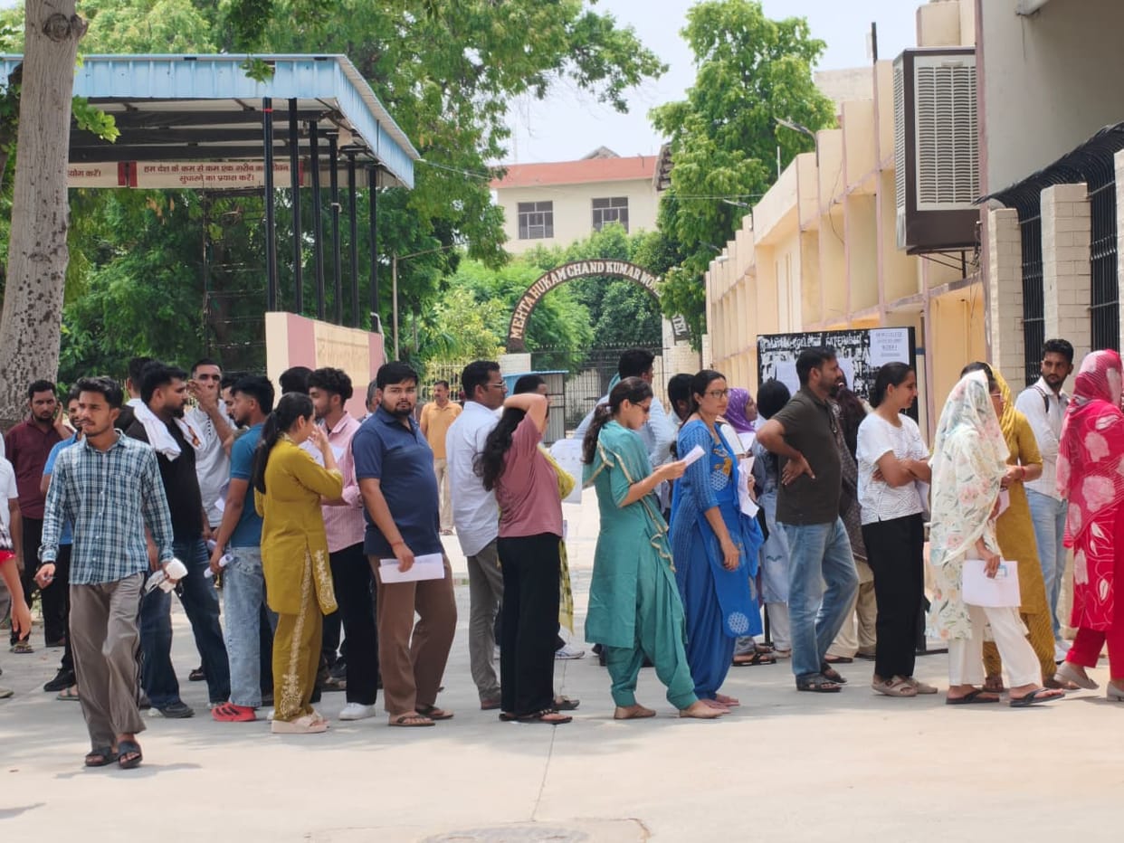 Entry allowed after four-layer security checks; 2,458 candidates took the exam