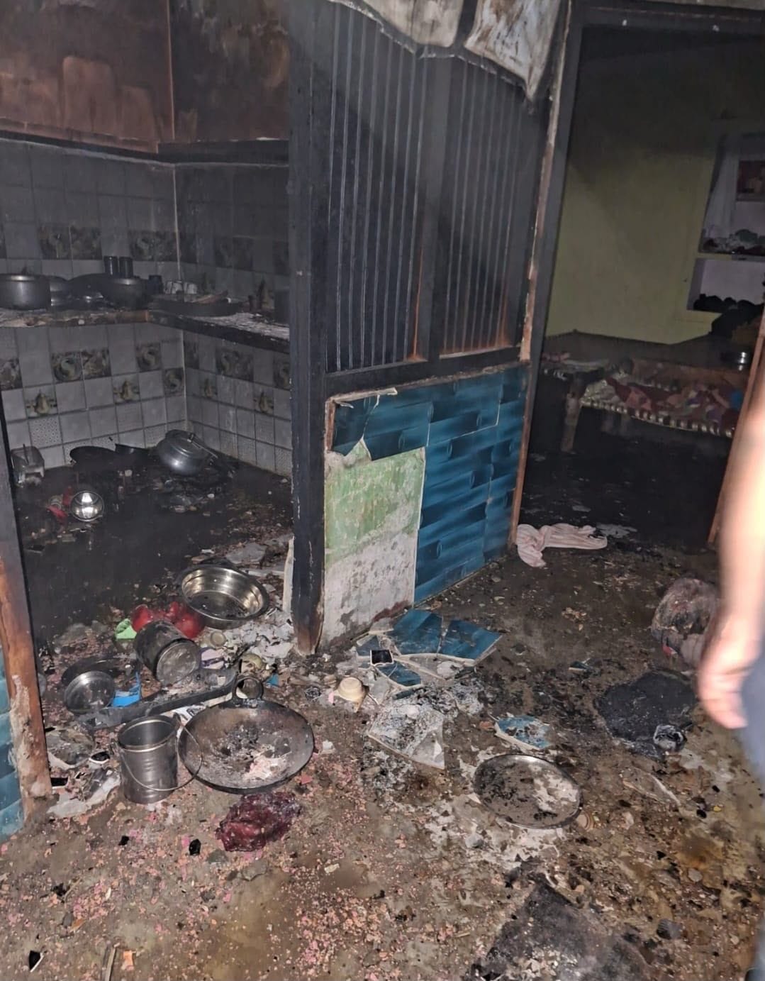 Fire caused by a leak; gas cylinder exploded with a loud blast.