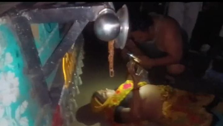 Woman lay down in front of a truck in protest against the power crisis.