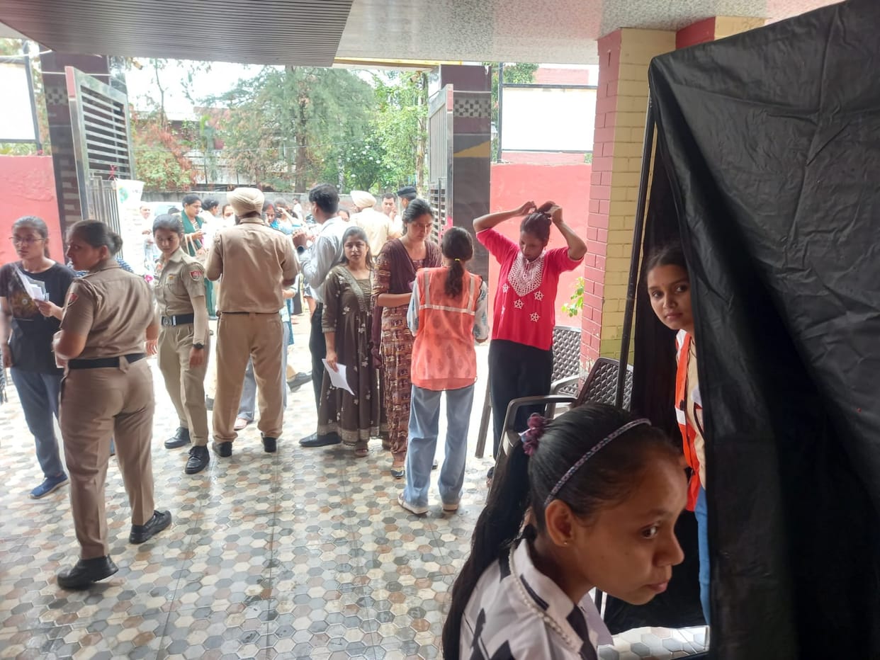 Female examinees made to remove rubber bands; even handkerchiefs had to be left outside.