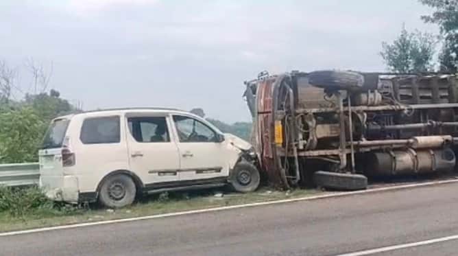 Truck loaded with cattle feed overturns after losing control; major accident averted.
