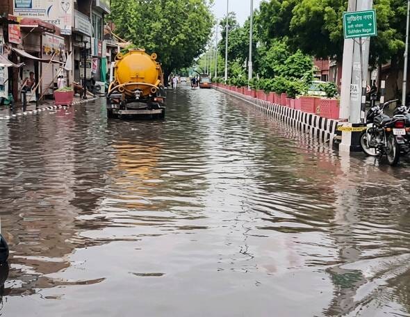 Rain: Claims of drain cleaning submerged along with the roads.