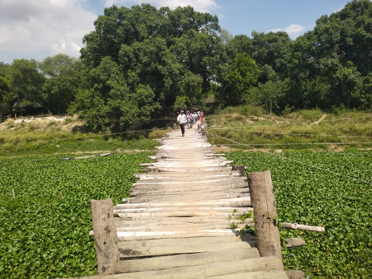 5,000 people commute using a temporary wooden-plank bridge at Kolghat.