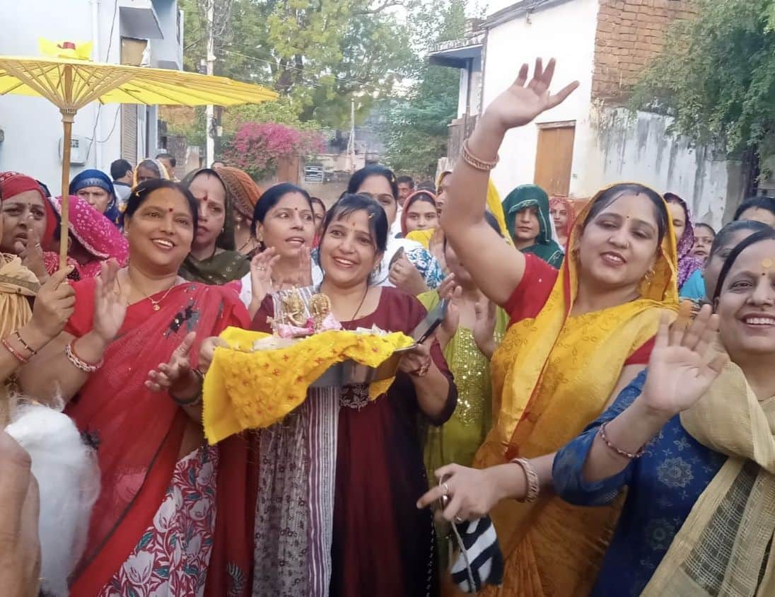 Women danced to the bhajans of Radha Rani during the morning procession.