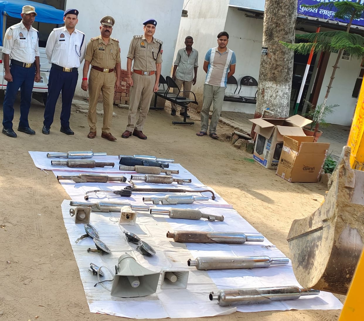 Pressure horns and silencers seized during checks.