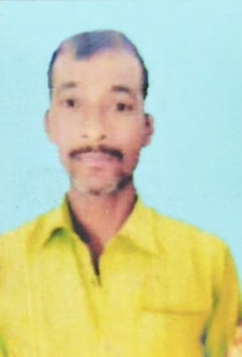 Body of middle-aged man found hanging from tree in front of house.