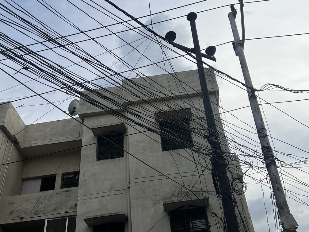 Power lines are spread like a spiderweb across the streets of the city and ten town panchayats.