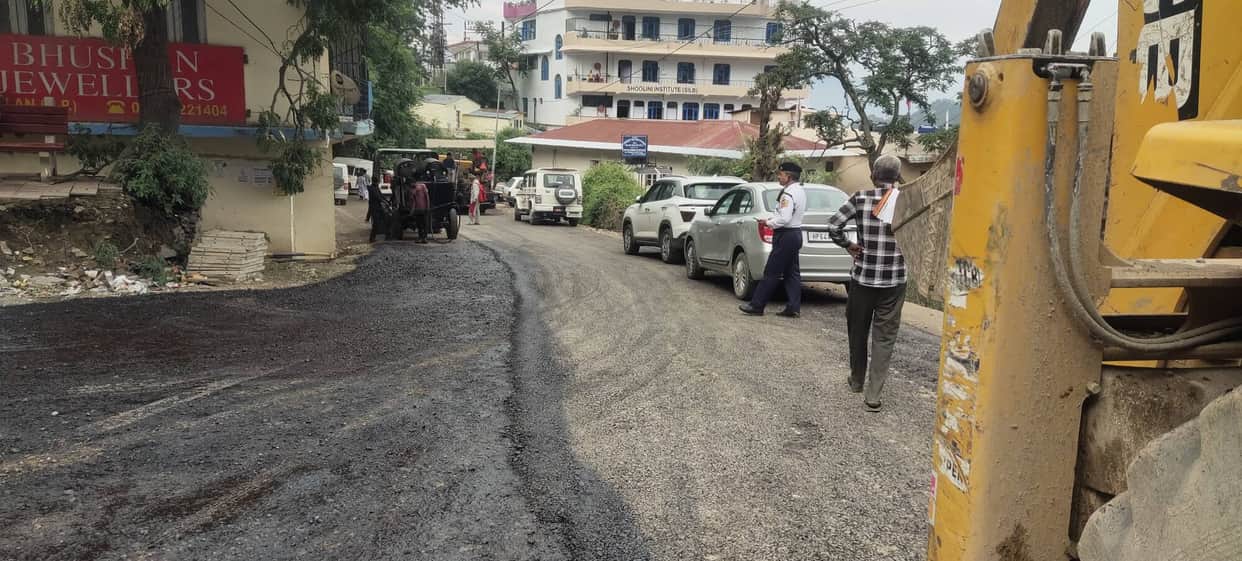 Metalling work begins on the Solan-Jaunaji road; three layers to be laid.
