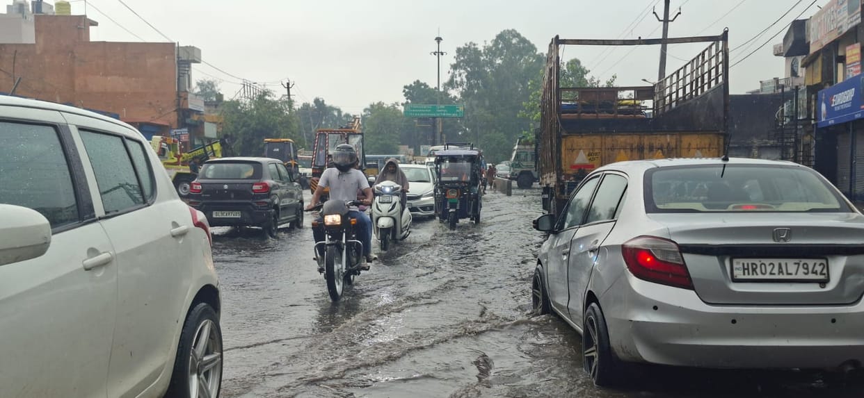Rain turns roads and streets into ponds; drains overflow