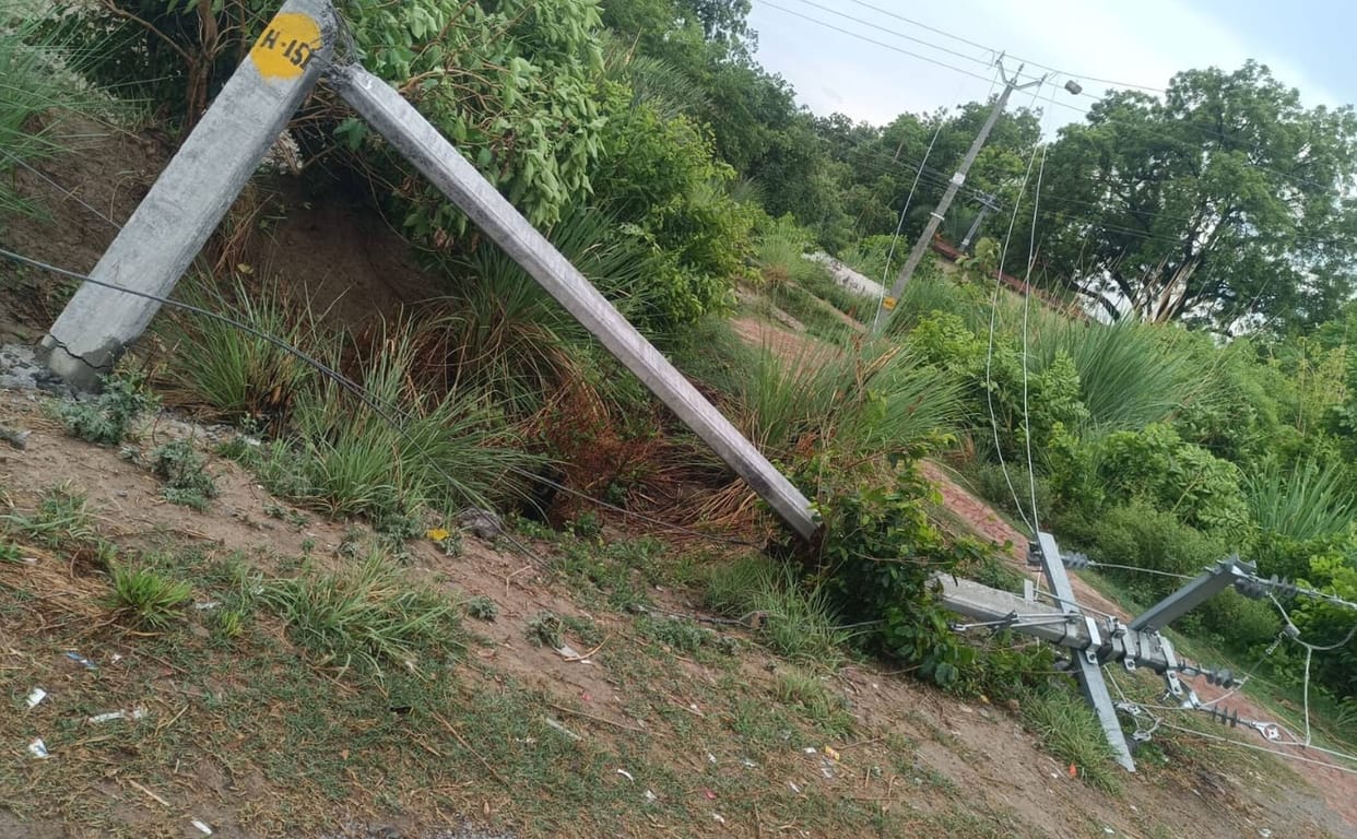 Four poles toppled by storm and rain; power cut for 13,000 homes.