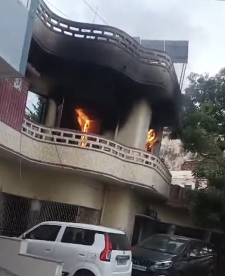 Fire caused by a short circuit; room contents reduced to ashes.