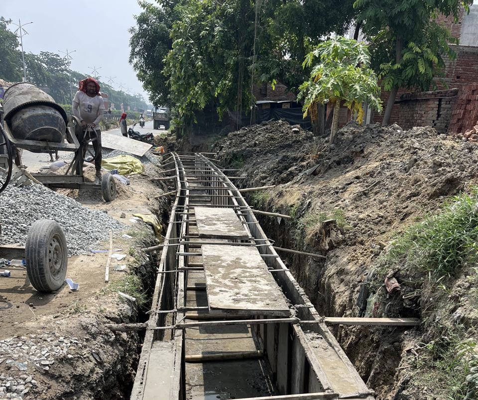 Work on constructing a drain along the service lane has begun.