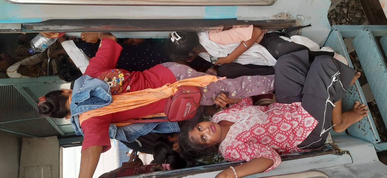 Massive overcrowding in express trains; passengers are traveling while sitting at the doorways.