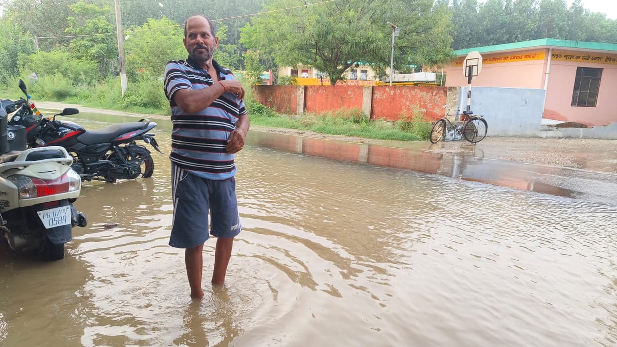 Rainwater enters Panjawar market; shops and the Shiva temple submerged.